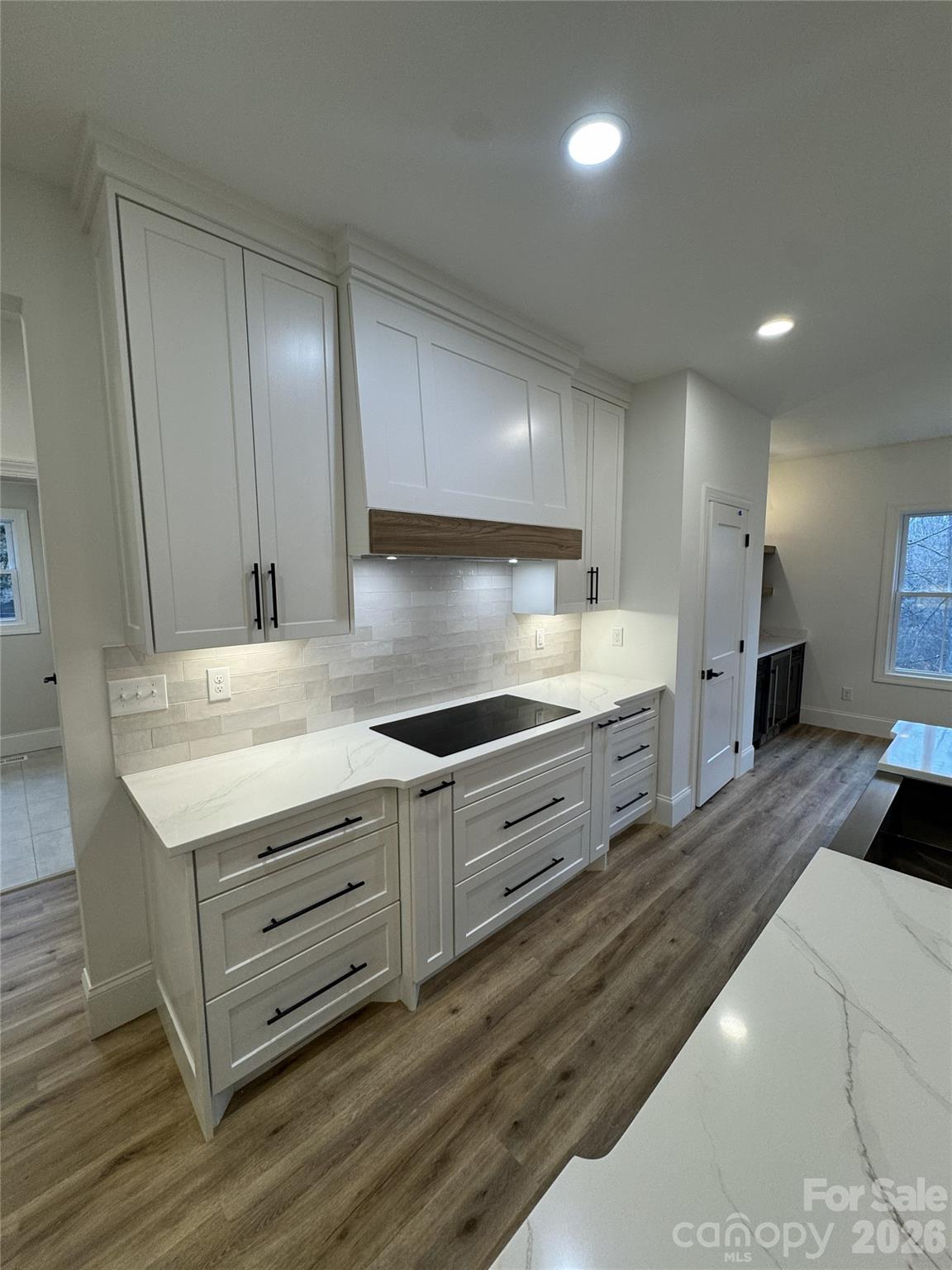 112 Wexford Point, Unit 5 Hickory, NC 28601 - Photo 11 of 47 a kitchen with granite countertop a stove and a sink