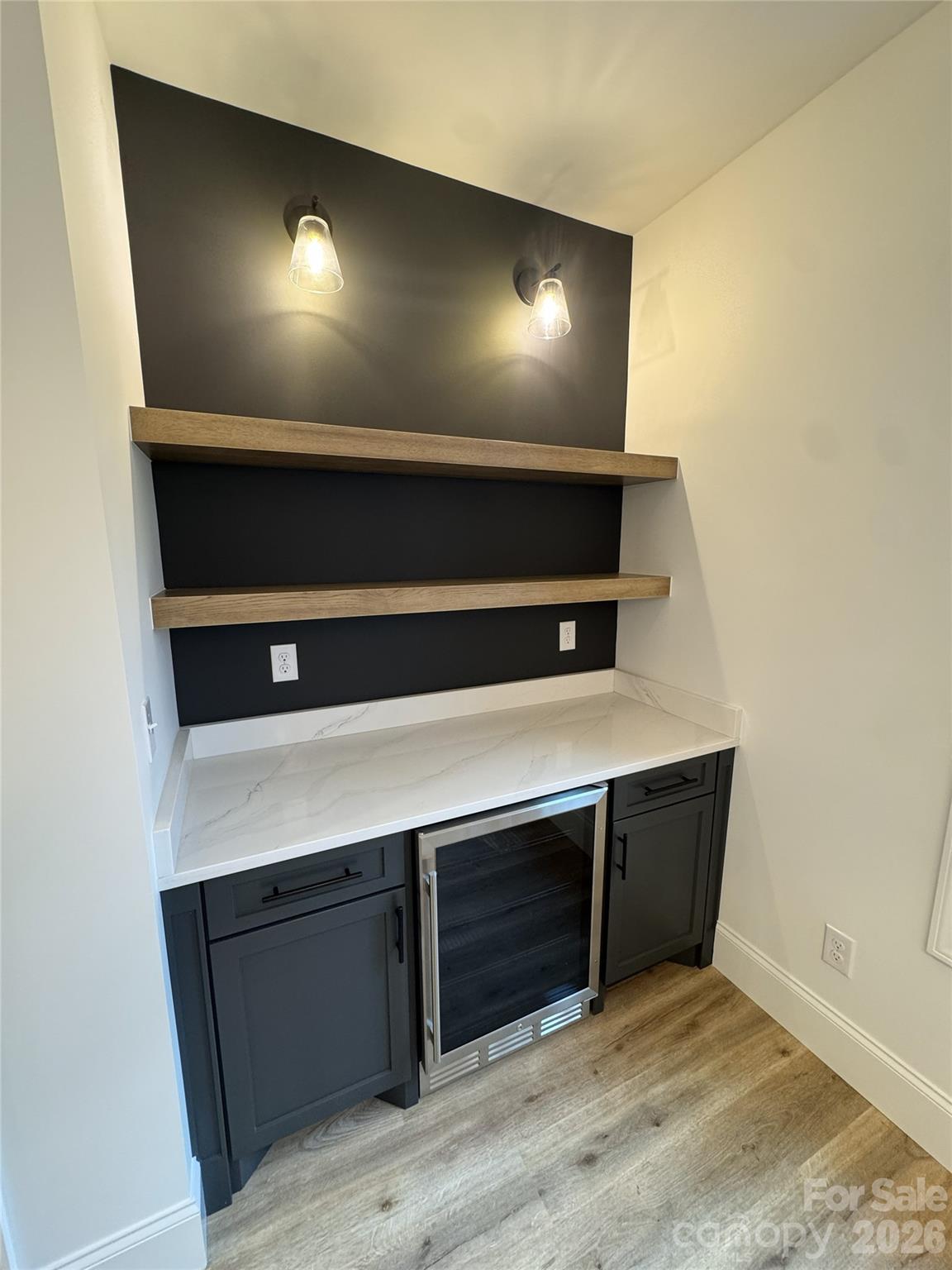 112 Wexford Point, Unit 5 Hickory, NC 28601 - Photo 16 of 47 a view of an empty room and wooden floor