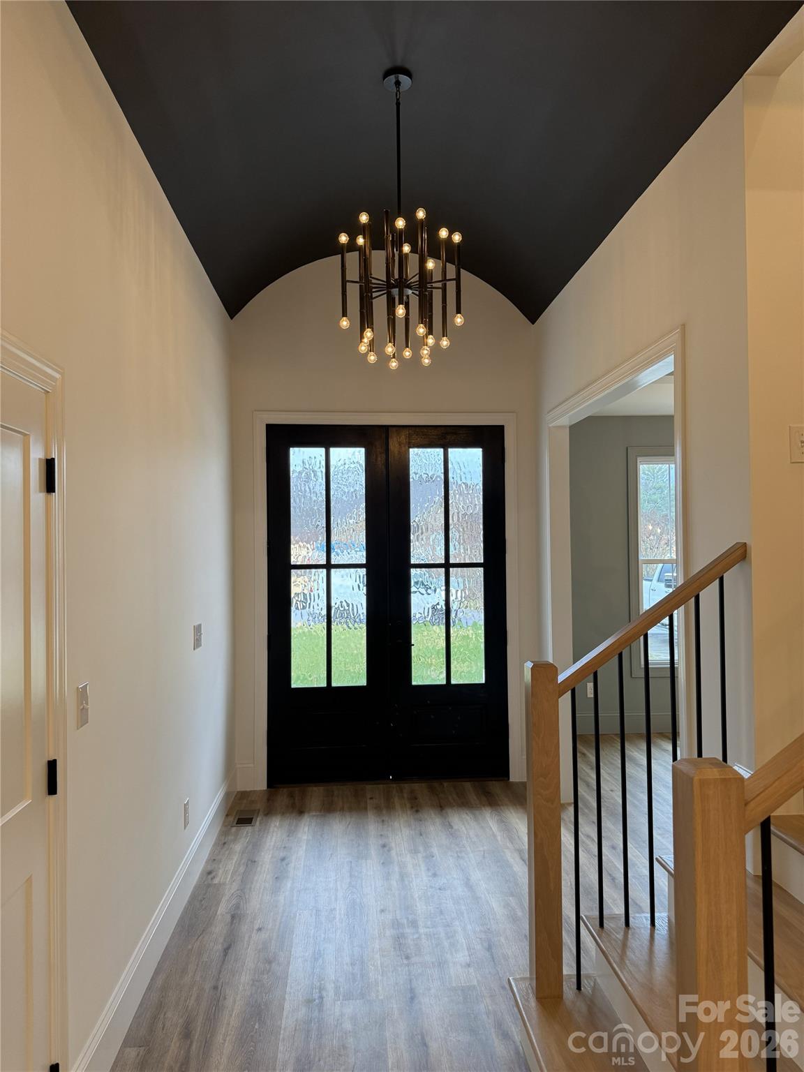 112 Wexford Point, Unit 5 Hickory, NC 28601 - Photo 2 of 47 a view of an empty room with window and wooden floor