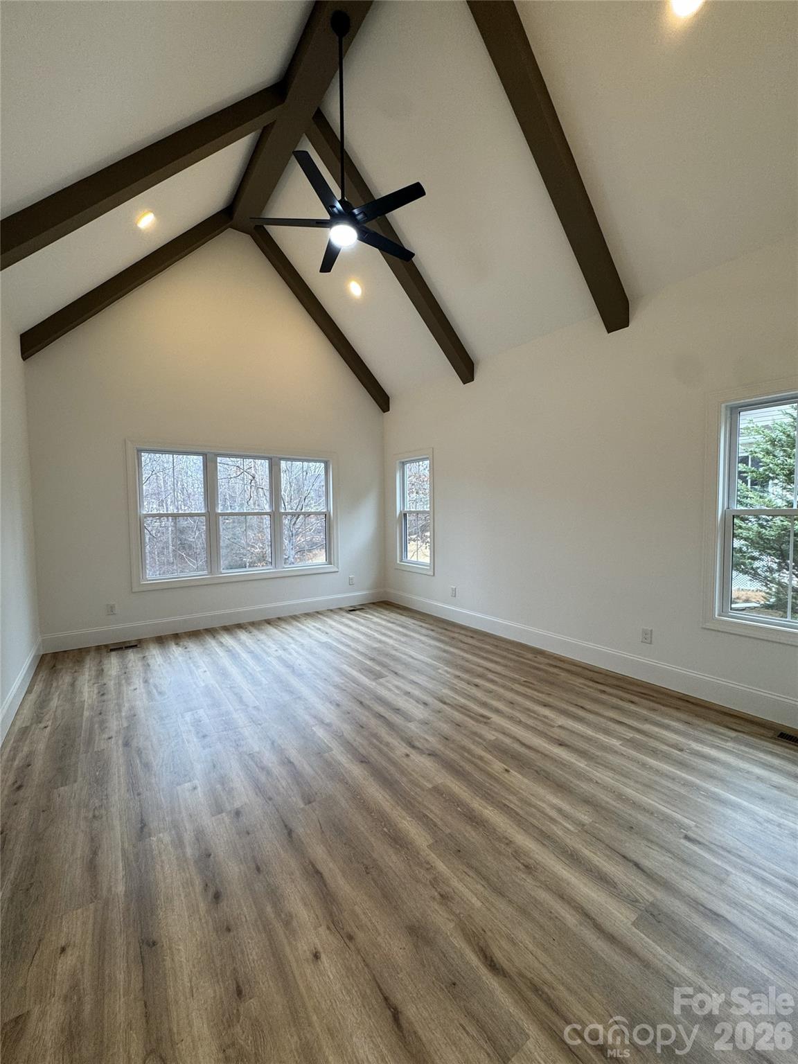 112 Wexford Point, Unit 5 Hickory, NC 28601 - Photo 26 of 47 a view of an empty room with wooden floor and windows