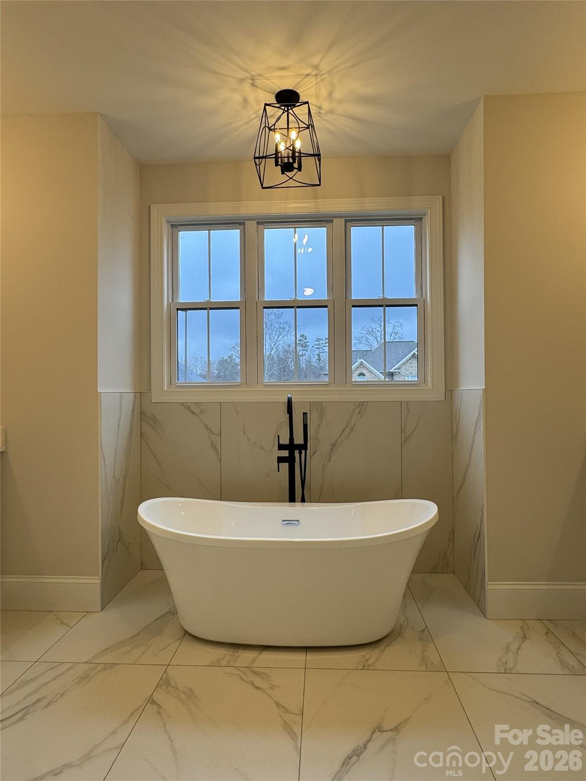 112 Wexford Point, Unit 5 Hickory, NC 28601 - Photo 29 of 47 a white bath tub sitting in a bathroom next to a window