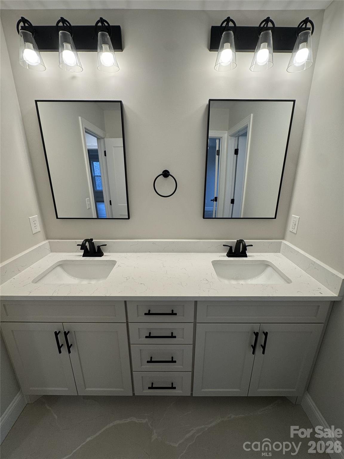 112 Wexford Point, Unit 5 Hickory, NC 28601 - Photo 35 of 47 a bathroom with a sink and a mirror