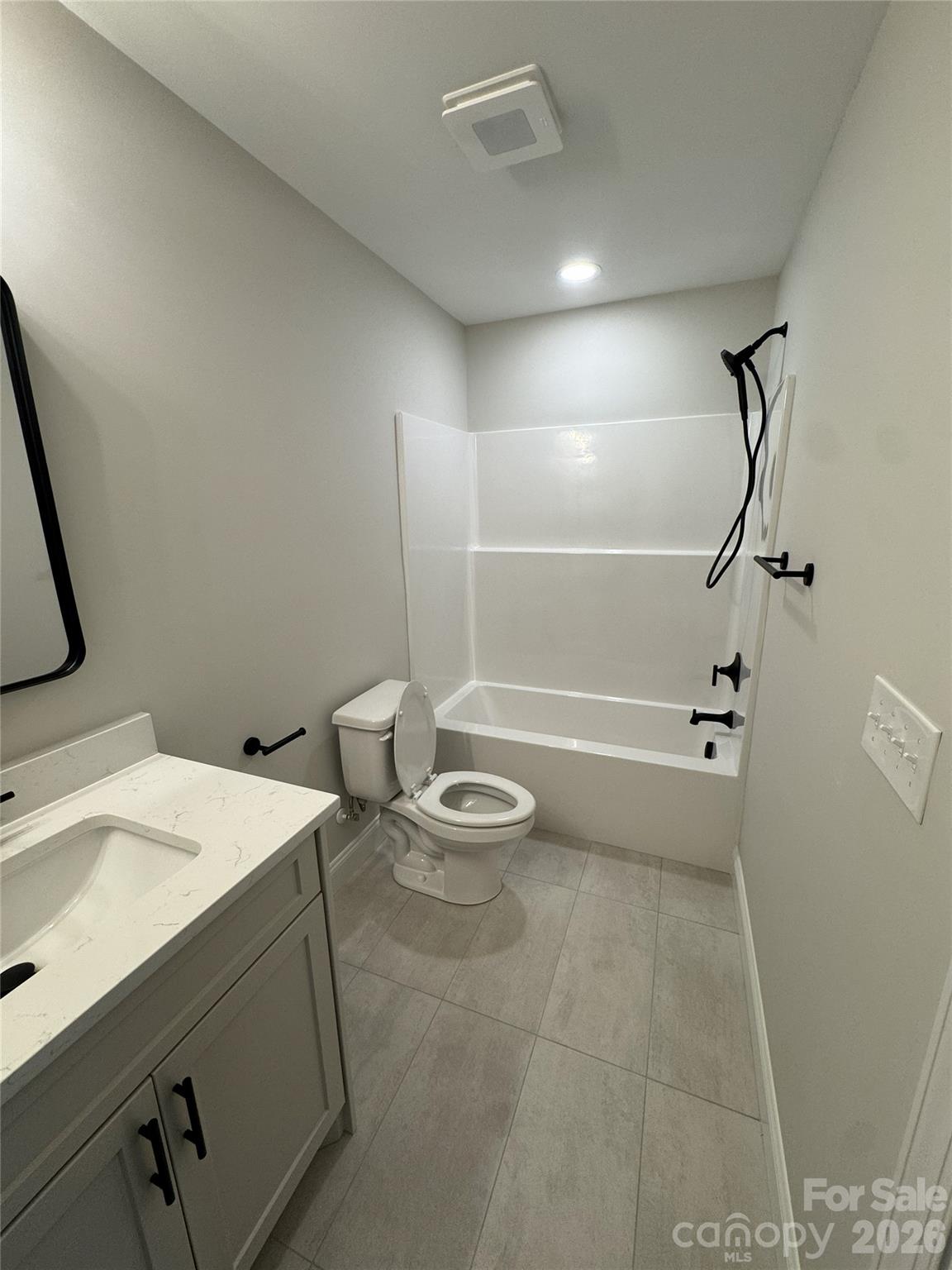 112 Wexford Point, Unit 5 Hickory, NC 28601 - Photo 38 of 47 a bathroom with a granite countertop sink a toilet and shower
