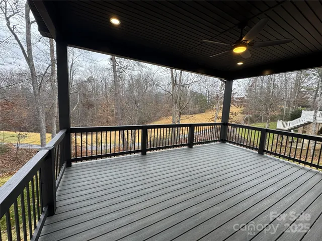 a view of balcony with wooden floor