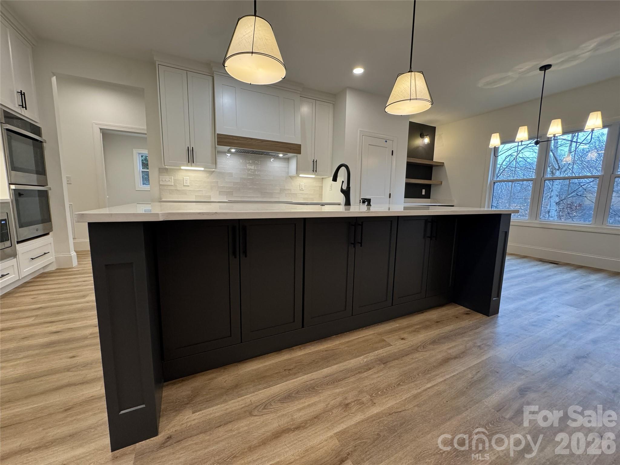 112 Wexford Point, Unit 5 Hickory, NC 28601 - Photo 10 of 47 a kitchen with stainless steel appliances a sink dishwasher a refrigerator and a stove