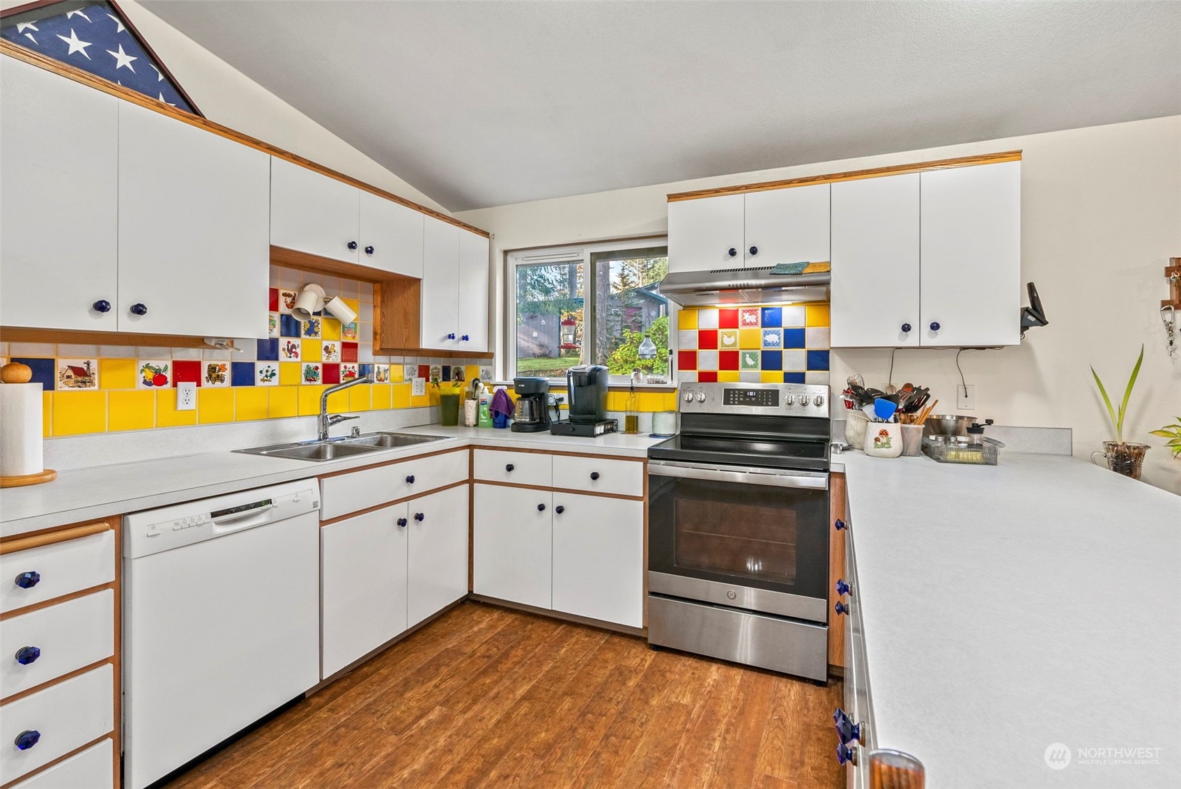 414 D Chilvers Road, Unit D Chehalis, WA 98532 - Photo 16 of 36 a kitchen with stainless steel appliances white cabinets and a refrigerator