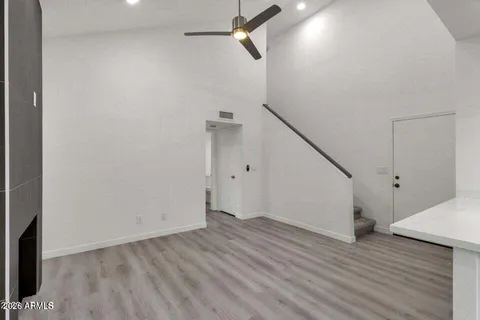 wooden floor in an empty room with a fireplace