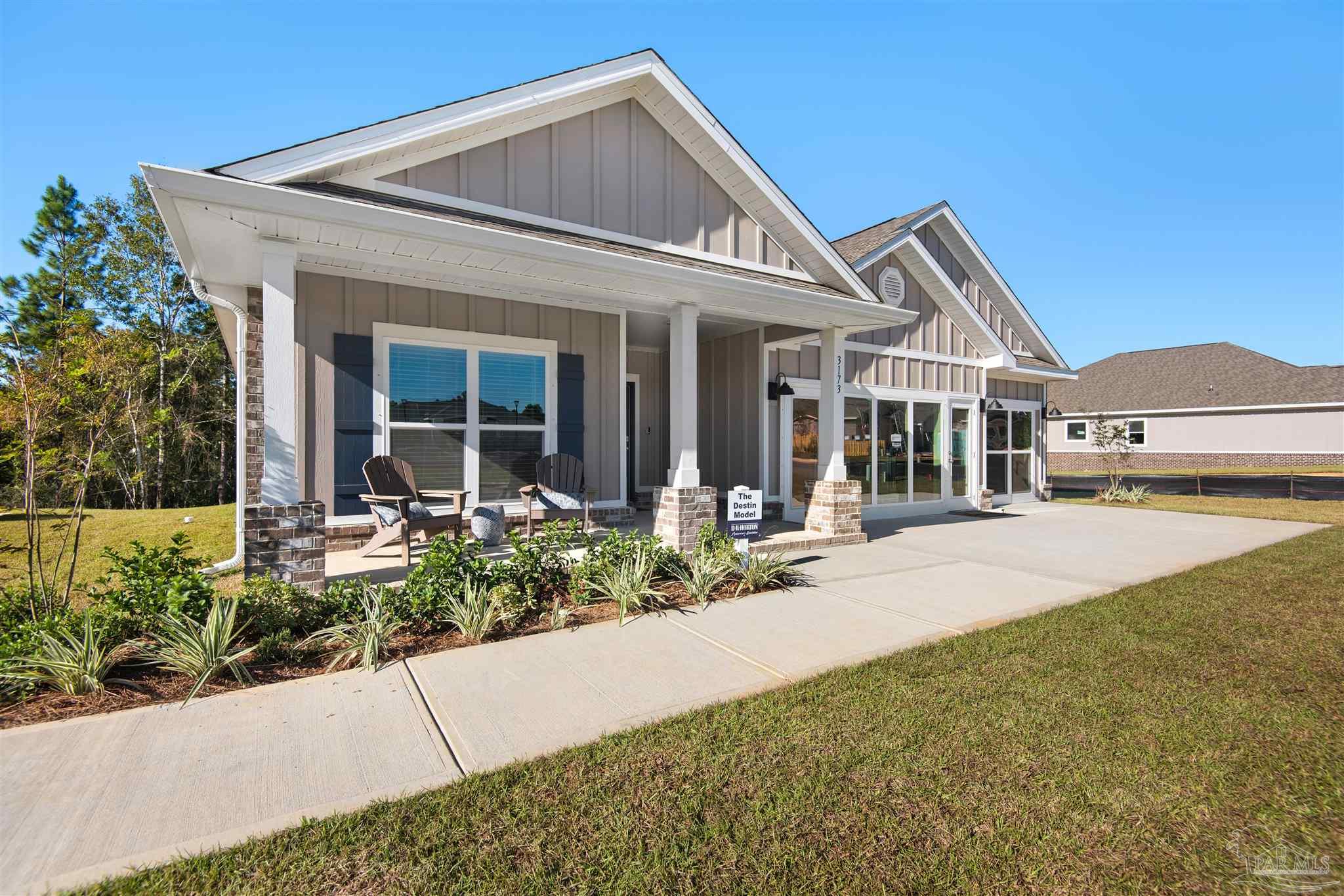 3408 Crossvine Road Cantonment, FL 32533 - Photo 2 of 45 front view of a house with a yard