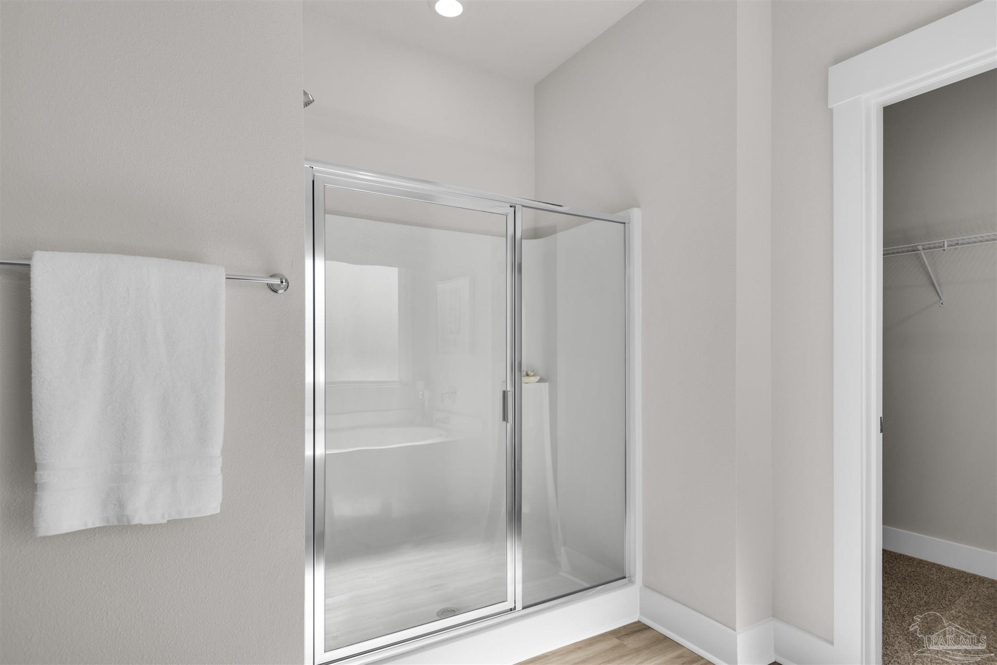 3408 Crossvine Road Cantonment, FL 32533 - Photo 37 of 45 a bathroom with a glass shower door