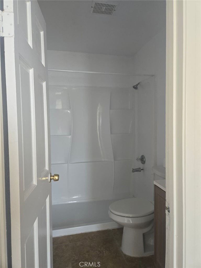 15879 Edwin Street Mojave, CA 93501 - Photo 10 of 12 a bathroom with a toilet and shower
