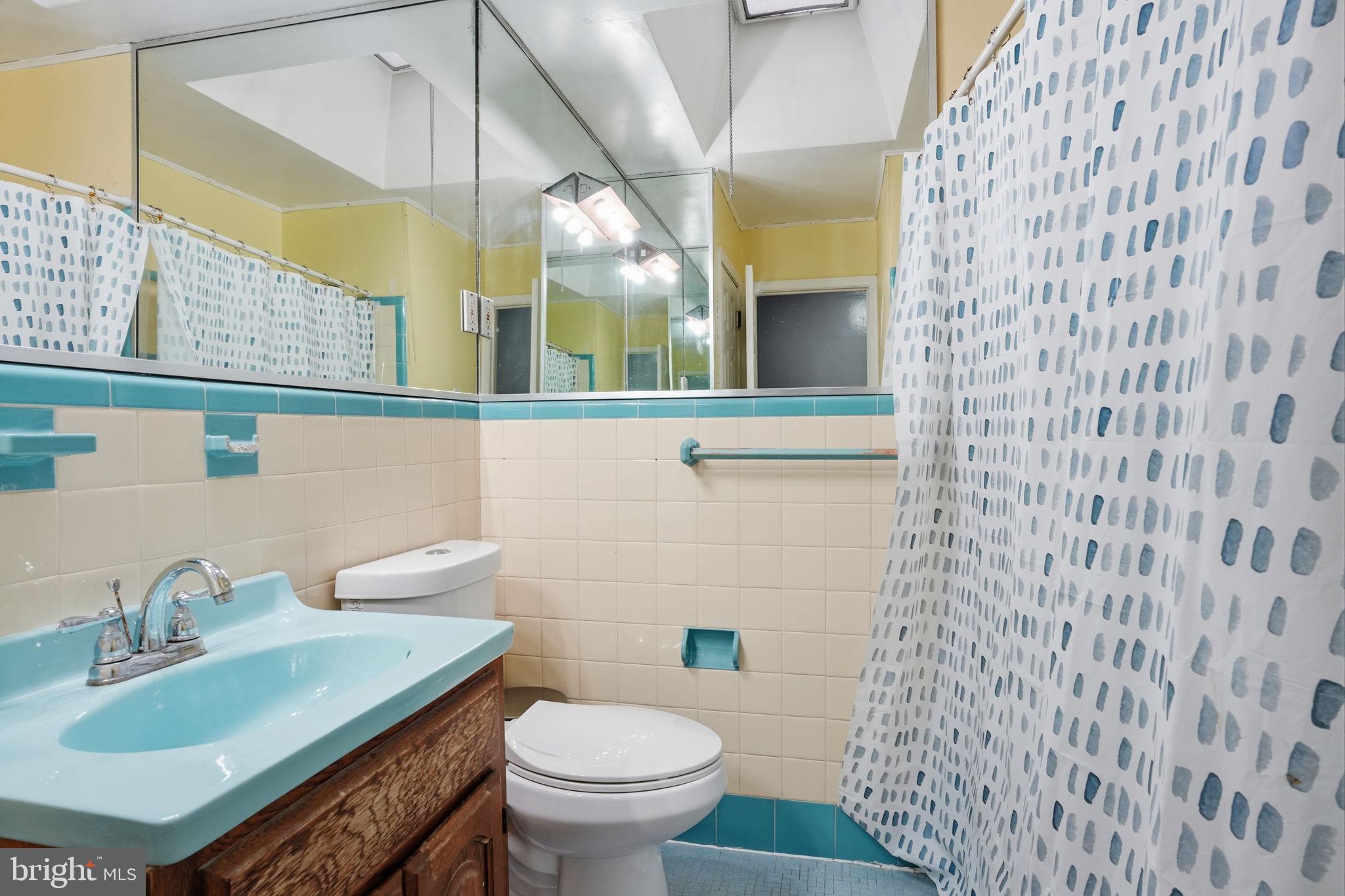 3254 Fordham Road Philadelphia, PA 19114 - Photo 15 of 25 a bathroom with a sink a toilet and mirror