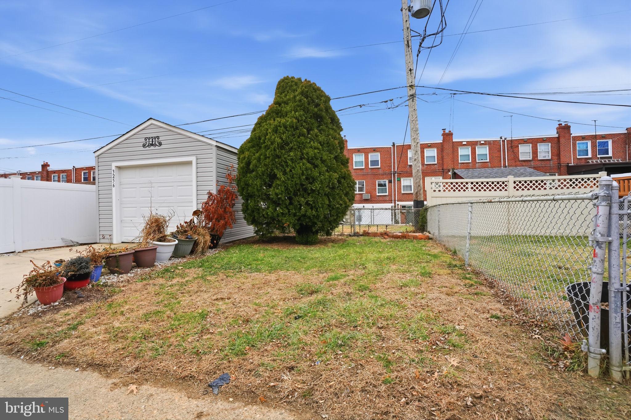 3254 Fordham Road Philadelphia, PA 19114 - Photo 25 of 25 a view of a house with a backyard and a tree