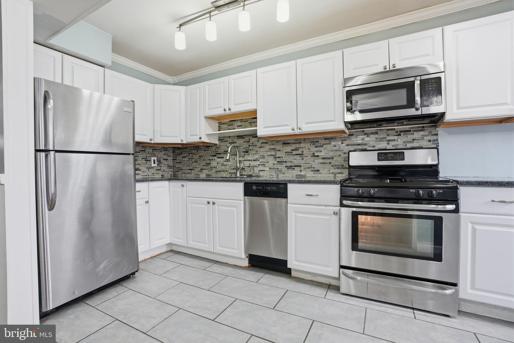 3254 Fordham Road Philadelphia, PA 19114 - Photo 6 of 25 a kitchen with cabinets stainless steel appliances and a counter space