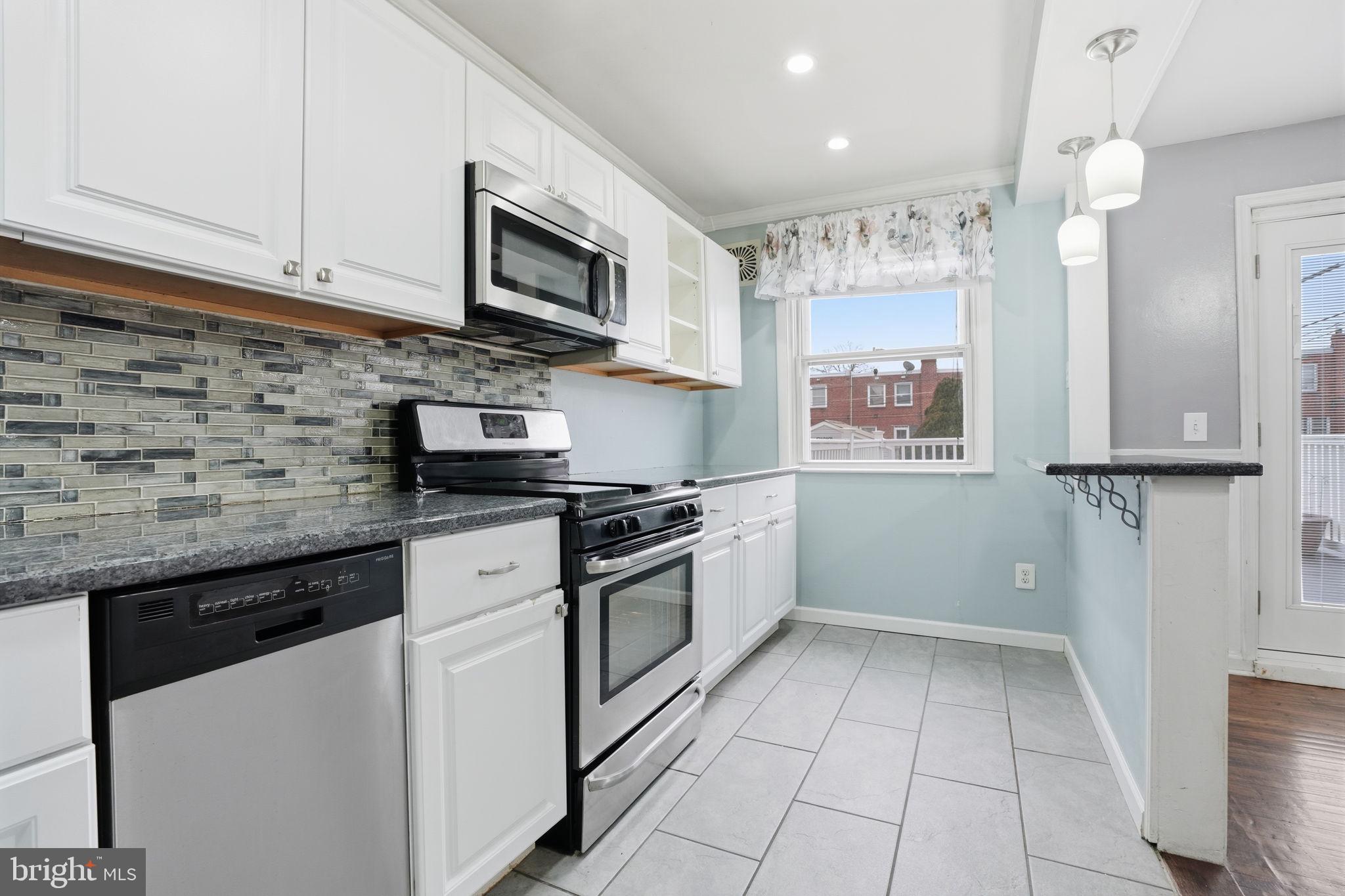 3254 Fordham Road Philadelphia, PA 19114 - Photo 8 of 25 a kitchen with stainless steel appliances granite countertop a sink and a stove