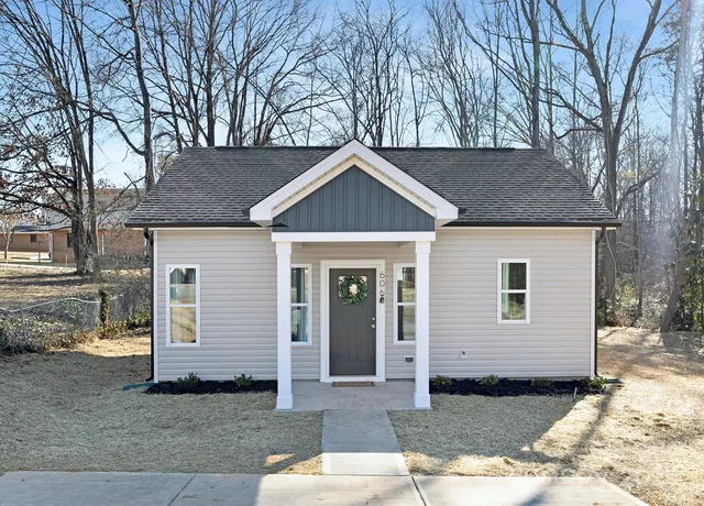a house with trees in the background