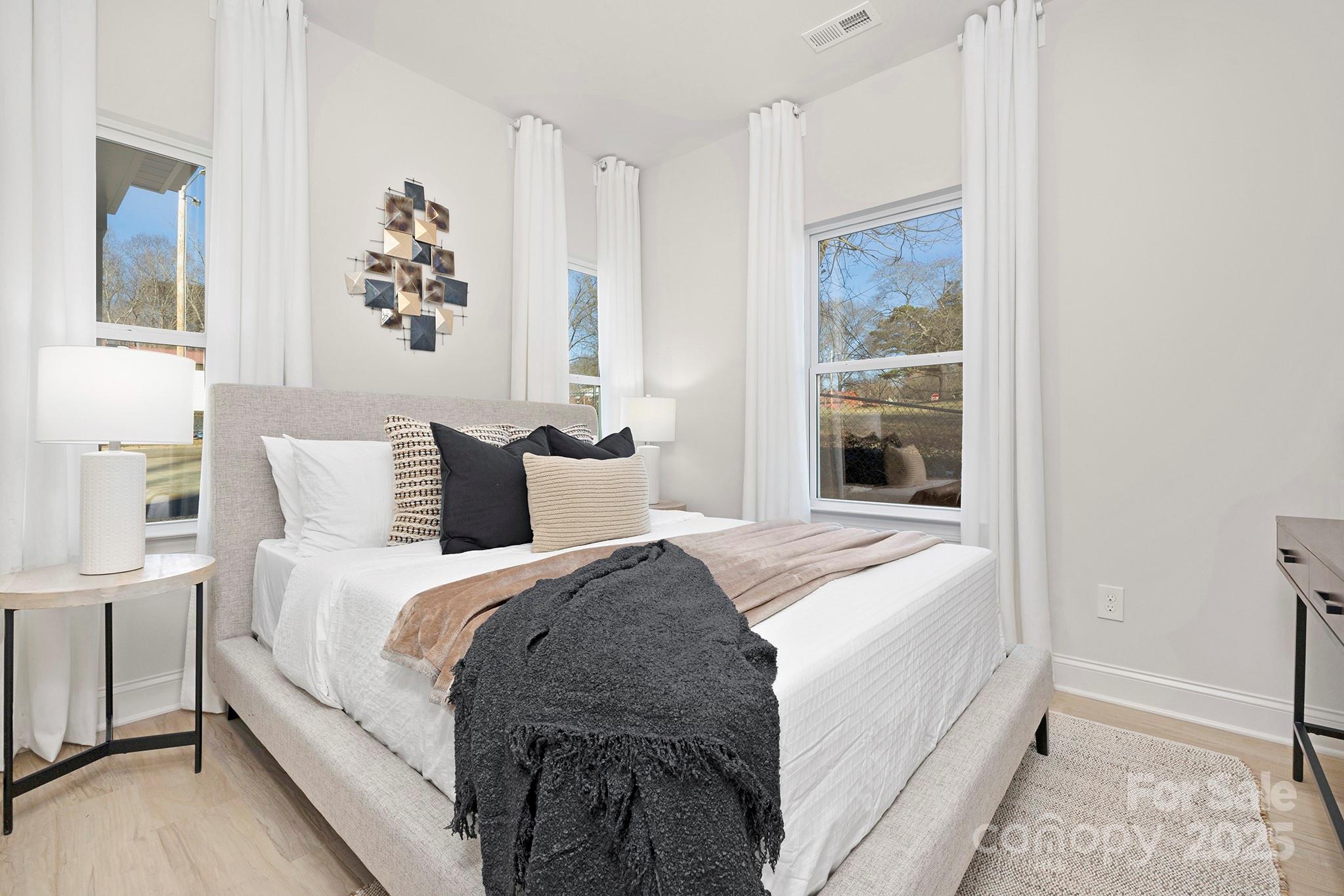 1124 Butler Street Salisbury, NC 28144 - Photo 12 of 19 a large white bed in a white room