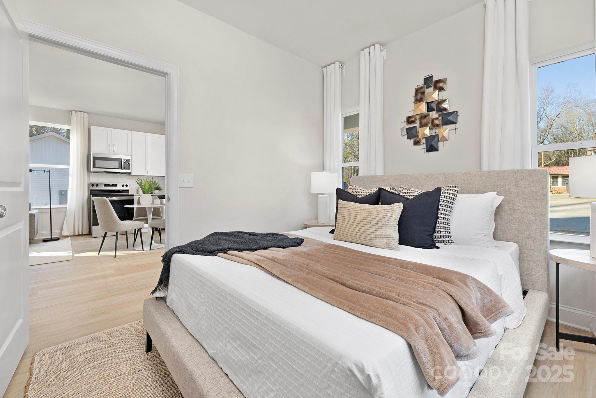 1124 Butler Street Salisbury, NC 28144 - Photo 13 of 19 a bedroom with bed and a painting on the wall