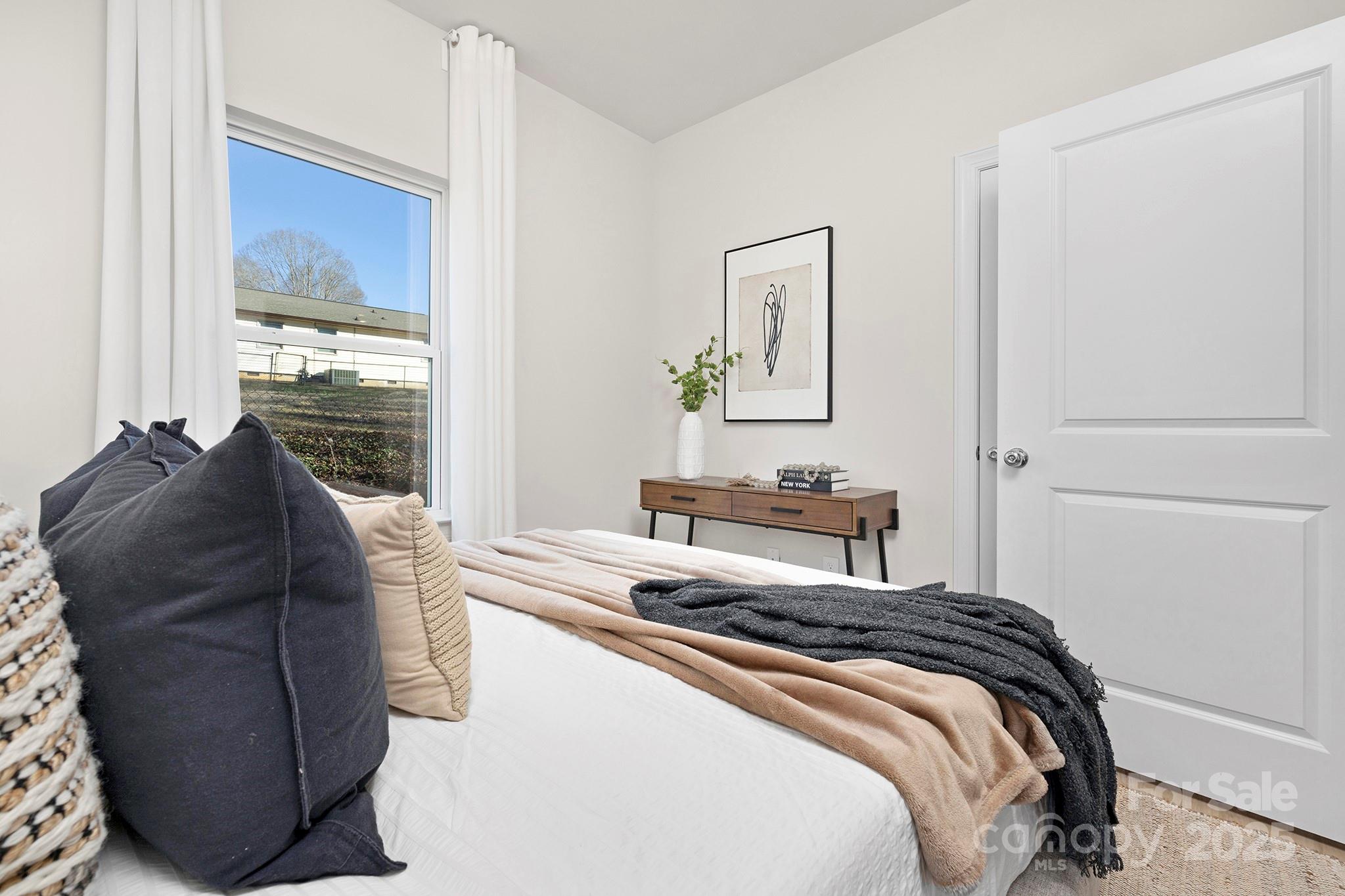 1124 Butler Street Salisbury, NC 28144 - Photo 14 of 19 a bedroom with a bed and a dresser