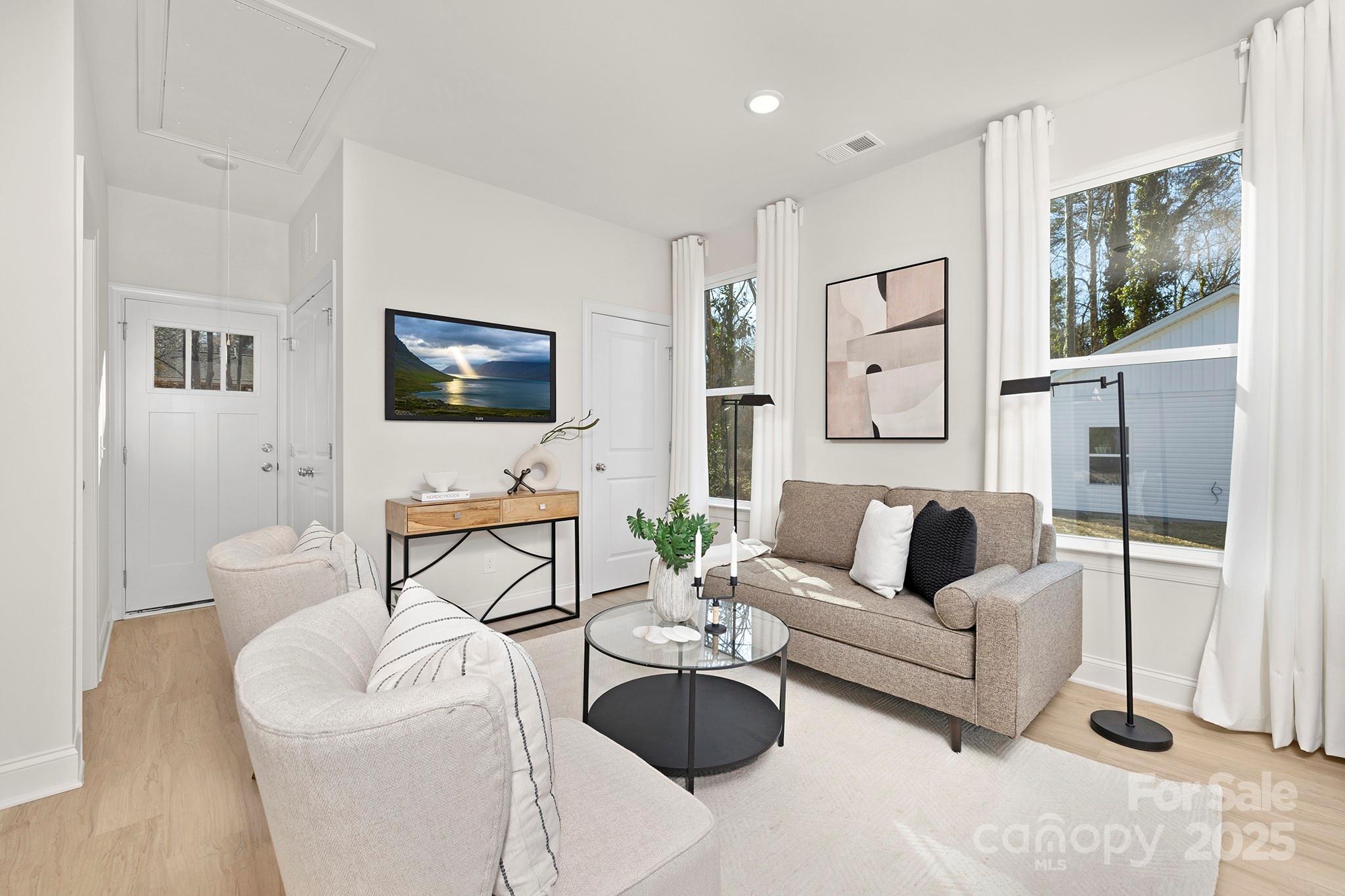 1124 Butler Street Salisbury, NC 28144 - Photo 5 of 19 a living room with furniture a flat screen tv and a window