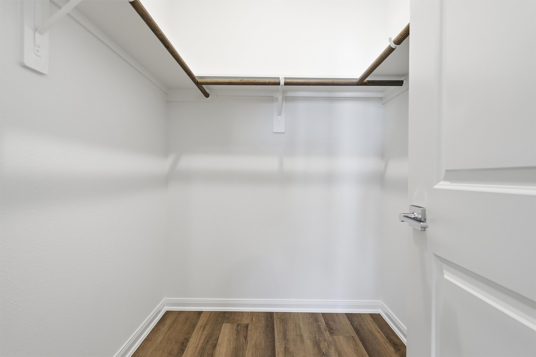 9906 Clark Road Houston, TX 77076 - Photo 31 of 50 a view of walk in closet with empty racks