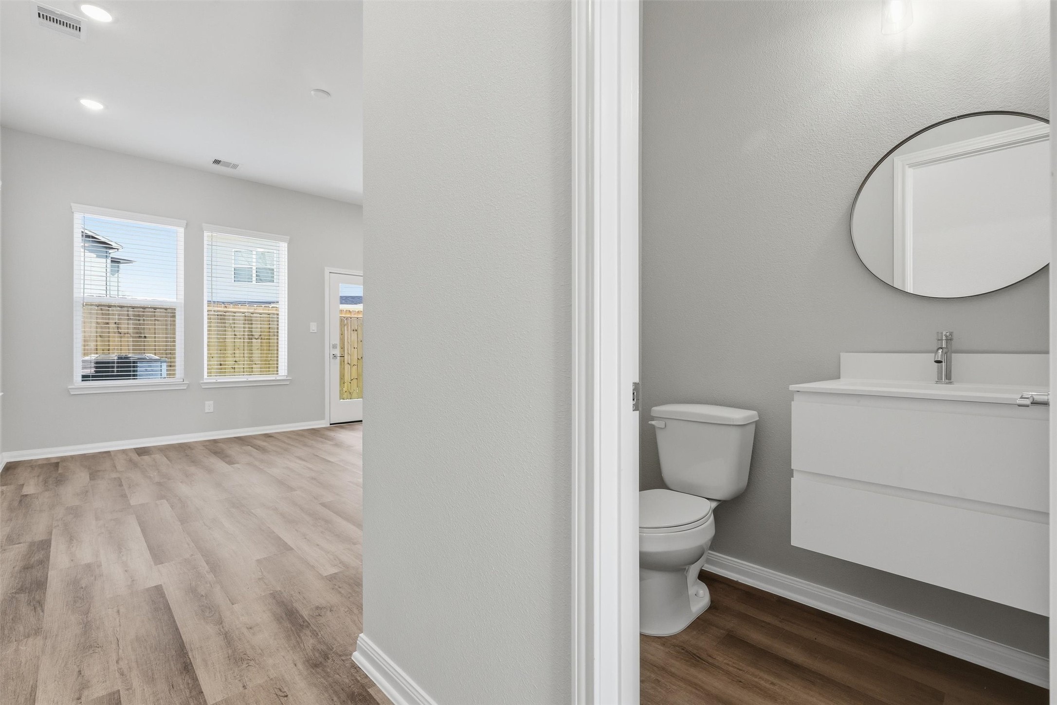 9906 Clark Road Houston, TX 77076 - Photo 40 of 50 a bathroom with a toilet a sink and mirror