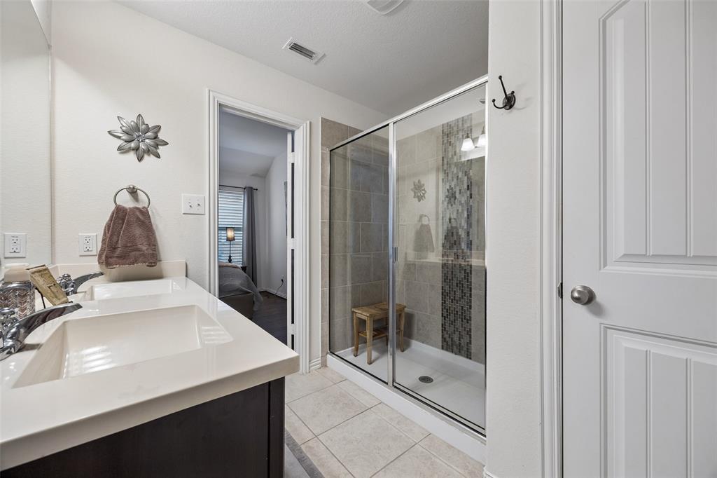 406 Madrone Lane Princeton, TX 75407 - Photo 15 of 30 Priamary Bathroom featuring a glass-enclosed shower with upgrade center tile feature