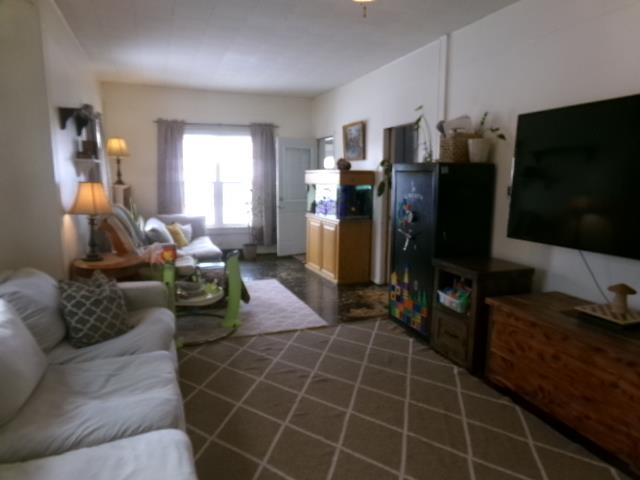 3609 Highway 26 Freeport, IL 61032 - Photo 5 of 17 a living room with furniture a flat screen tv and a window
