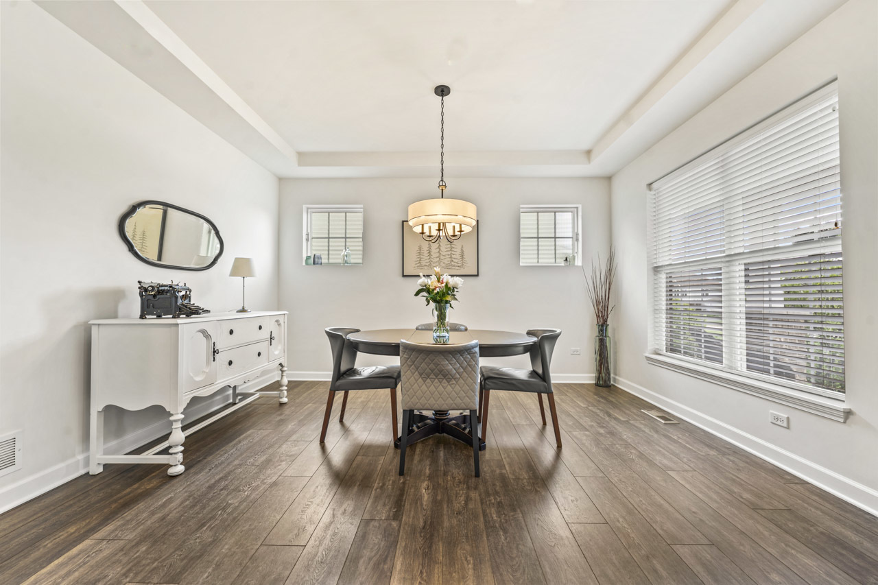 1251 West Thomas Road Wheaton, IL 60187 - Photo 3 of 57 a dining room with furniture a chandelier and wooden floor