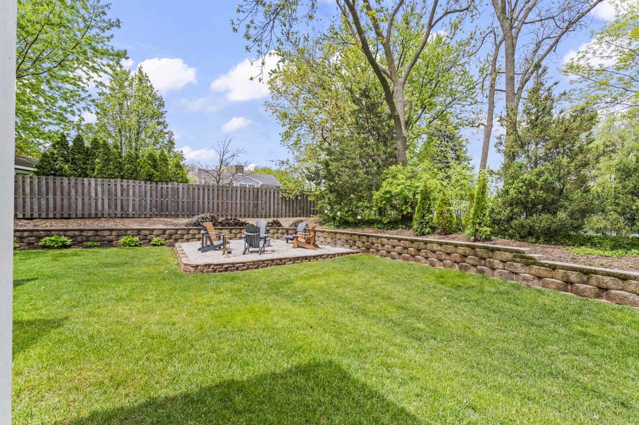 1251 West Thomas Road Wheaton, IL 60187 - Photo 49 of 57 a view of a chair and table on the wooden deck