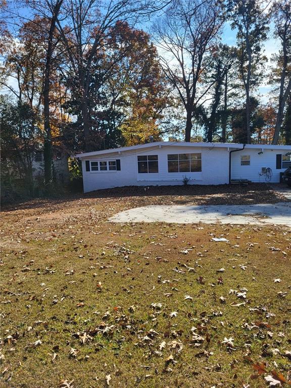 a view of a yard with large trees