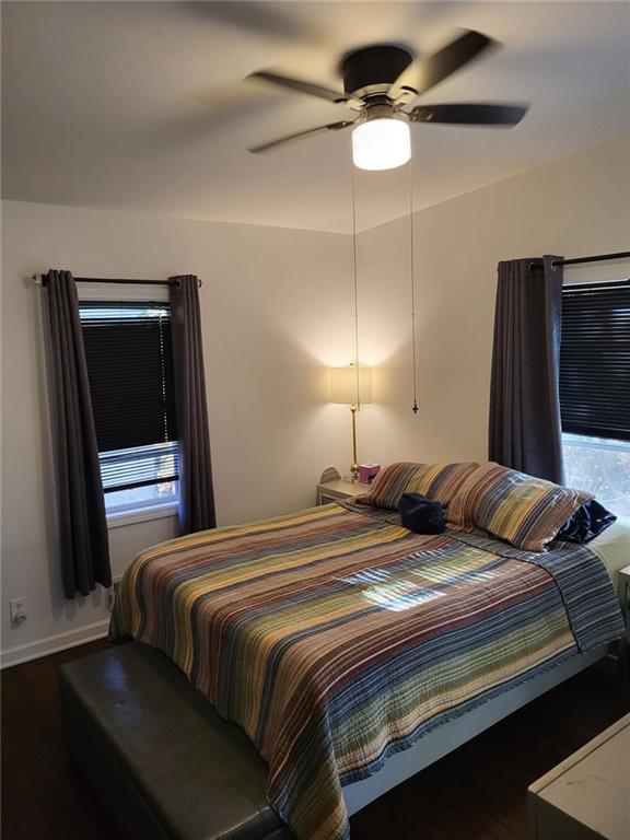 Undisclosed Address Decatur, GA 30032 - Photo 12 of 25 a bedroom with a bed and a chandelier