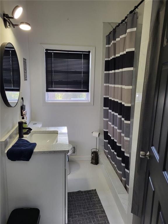 Undisclosed Address Decatur, GA 30032 - Photo 18 of 25 a bathroom with a sink and a mirror