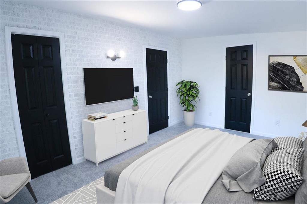 Undisclosed Address Decatur, GA 30032 - Photo 25 of 25 a bedroom with a bed and a flat screen tv