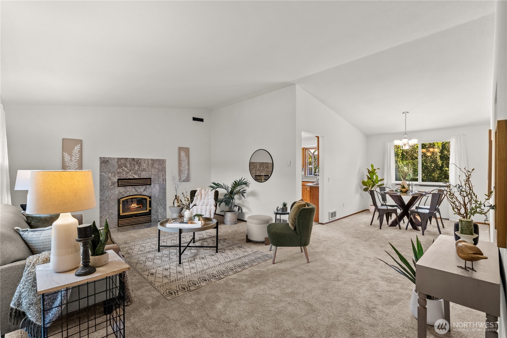 518 Hubbard Road Lynnwood, WA 98036 - Photo 2 of 39 a living room with furniture a fireplace and a flat screen tv