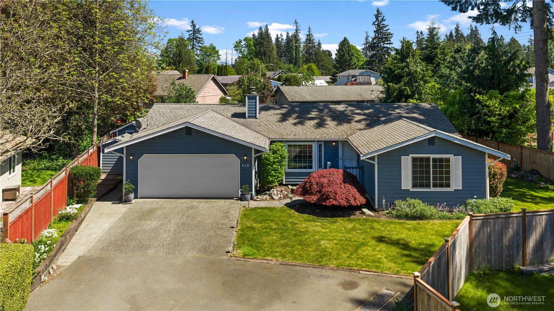 518 Hubbard Road Lynnwood, WA 98036 - Photo 34 of 39 a front view of house with yard and trees in the background