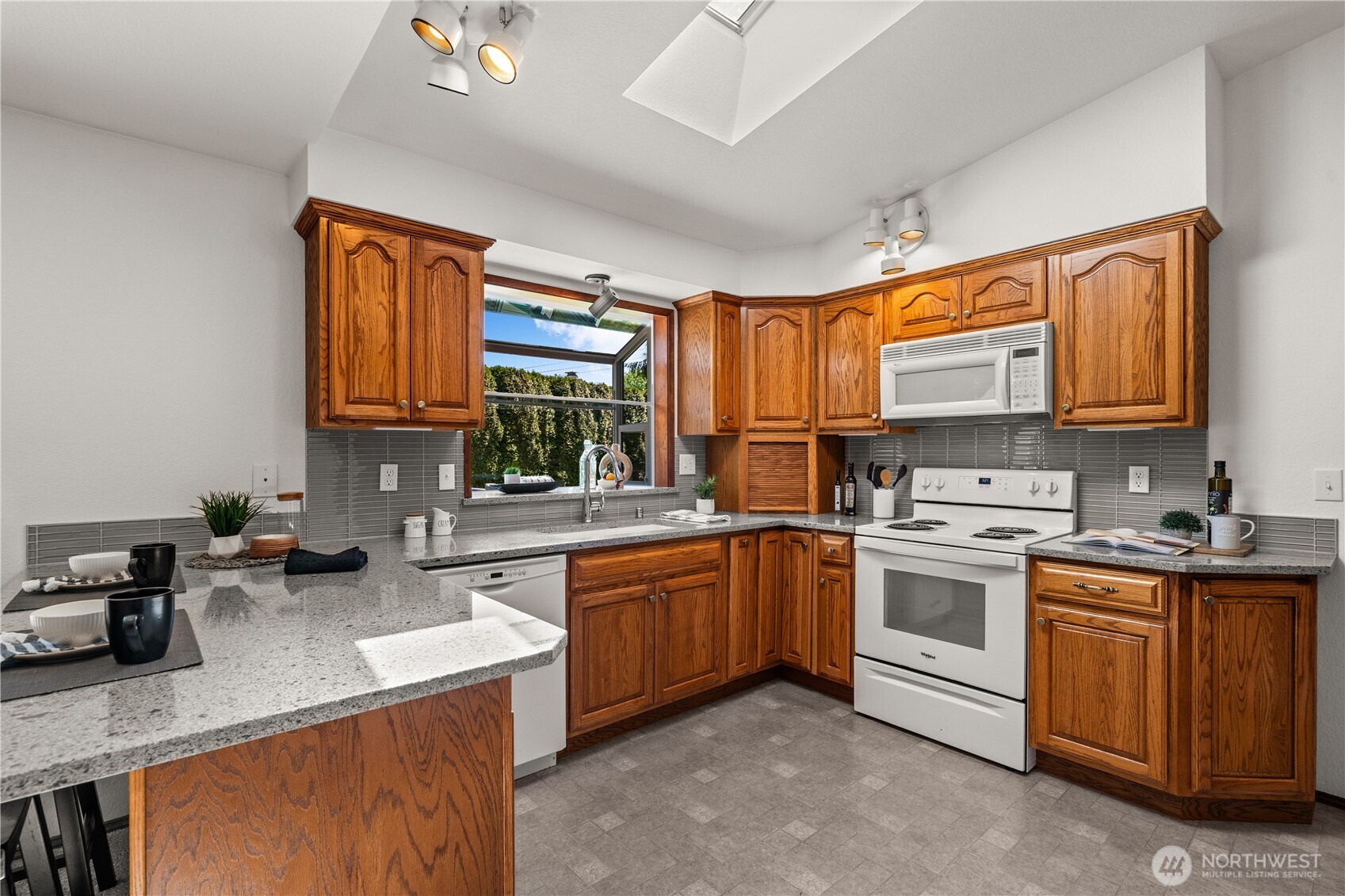 518 Hubbard Road Lynnwood, WA 98036 - Photo 10 of 39 a kitchen with granite countertop a sink stainless steel appliances and cabinets