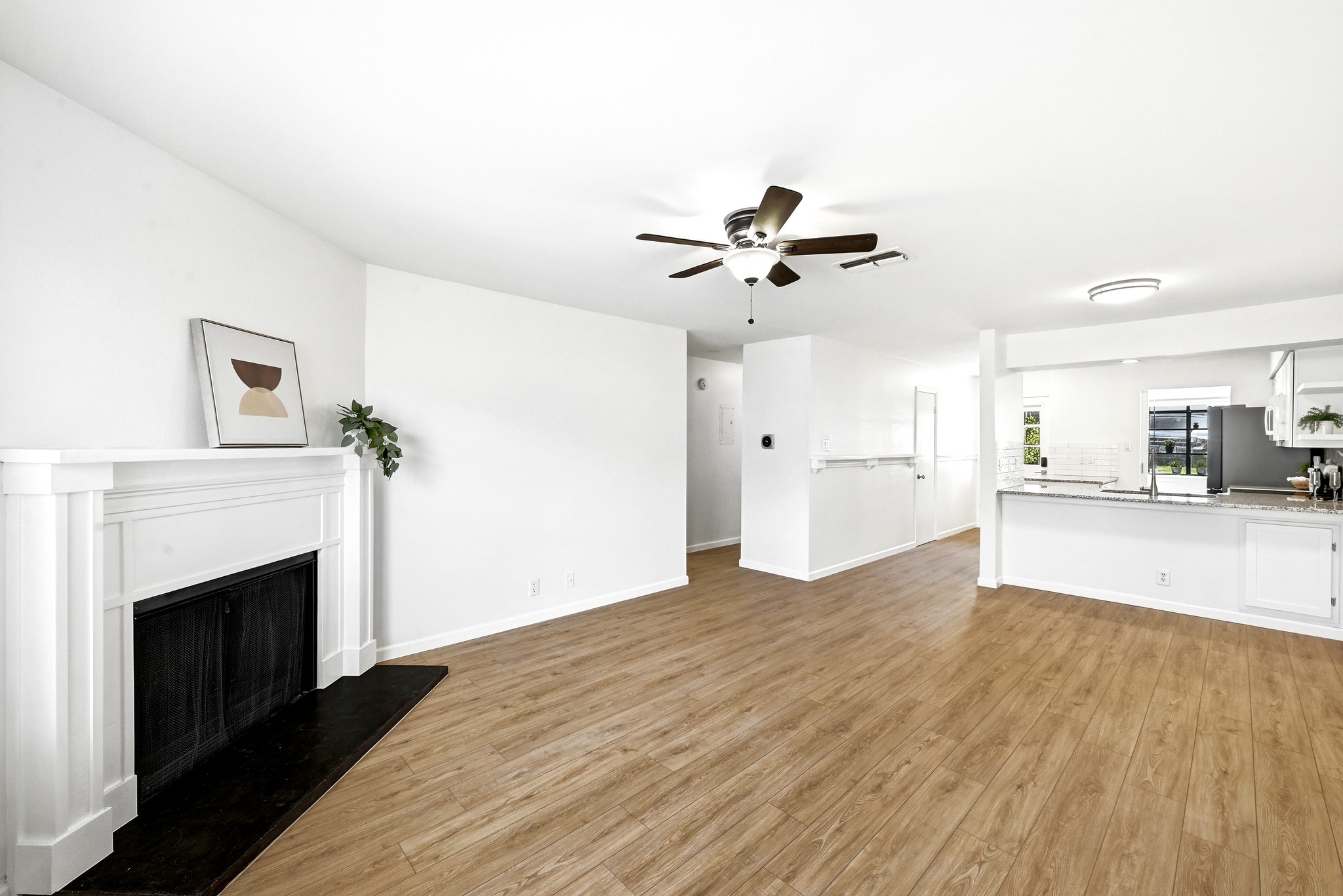 2215 Post Road, Unit 1026 Austin, TX 78704 - Photo 3 of 29 2026 luxury vinyl plank flooring and fresh white paint throughout.