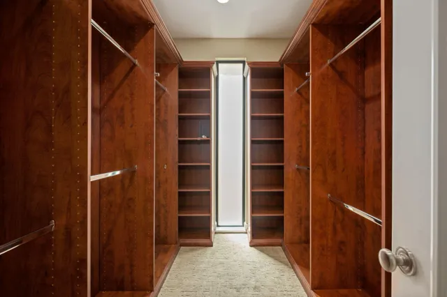 a view of closet area with empty racks