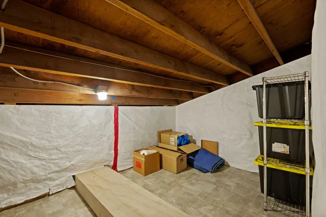 a bed room with a bed and a dresser