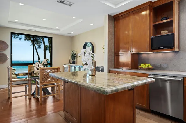 a kitchen with a stove a sink and a refrigerator