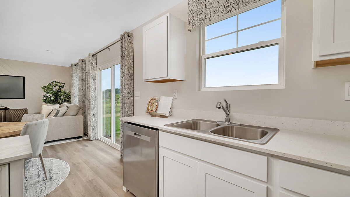 1811 Overland Drive Plainfield, IL 60586 - Photo 26 of 39 a kitchen with a sink cabinets and a wooden floor