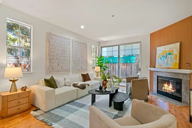 a living room with furniture and a fireplace