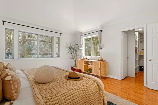 a bedroom with furniture and a window