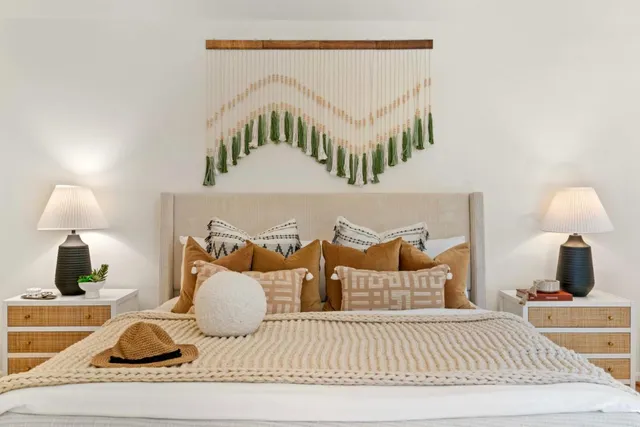 a bedroom with furniture and a lamp