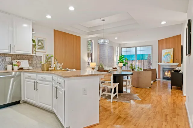 a kitchen with center island table and chairs in it