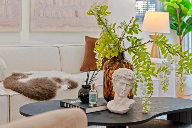 a vase of flowers sitting on a table