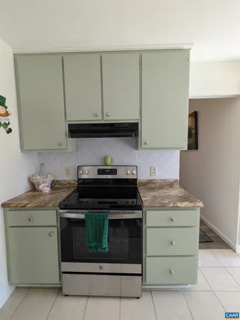 a view of a patio with table and chairs and potted plants