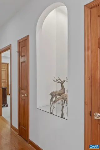 a bedroom with furniture and large window