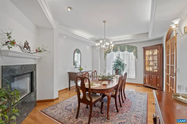 a living room with furniture and floor to ceiling windows