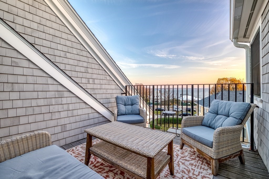 a view of a roof deck with couches